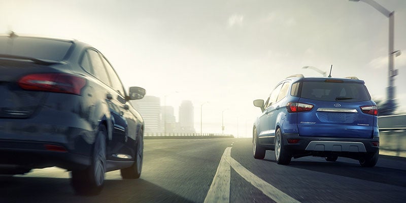 Rear view of a 2021 Ford EcoSport being driven on the highway. | Ford Service in Little Rock, AR.