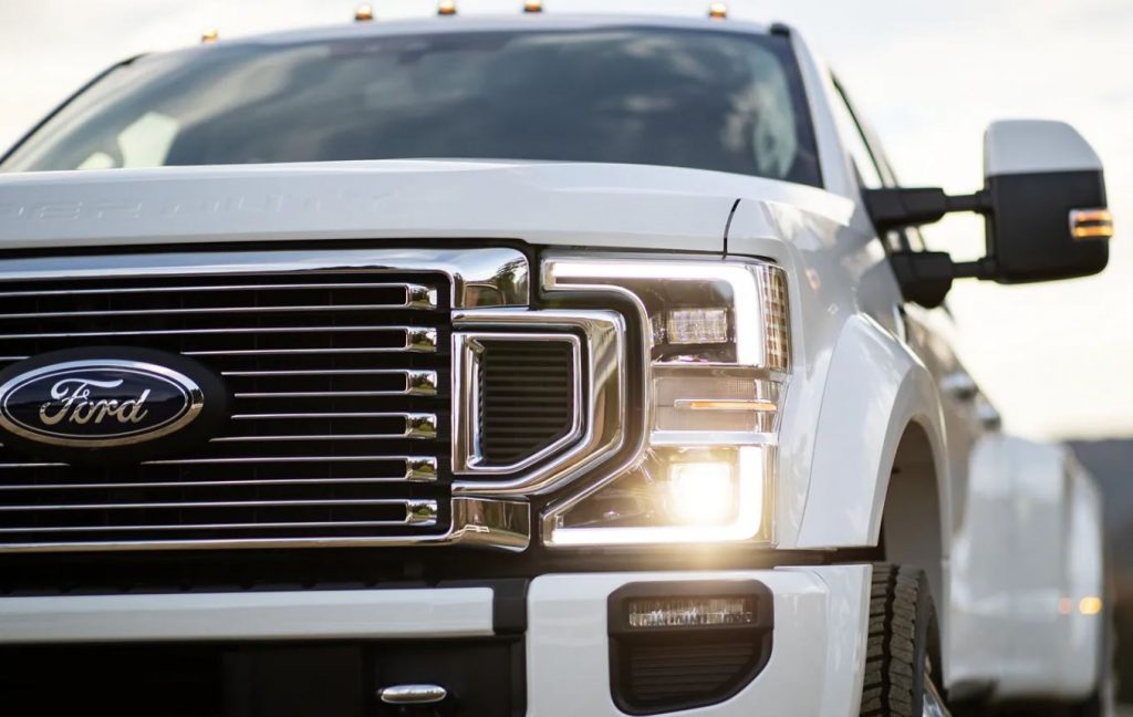 Close view of the grille area of a white 2022 Ford Super Duty. | Ford dealer in Little Rock, AR.
