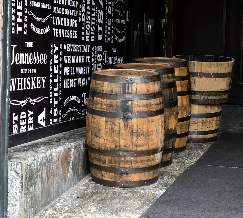 Whiskey barrels on the ground in a distillery. | Things to do in Little Rock, AR.