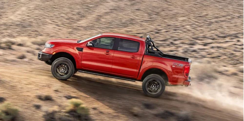 A red 2022 Ford Ranger being driven up a dirt hill. | Ford dealer in Little Rock, AR.