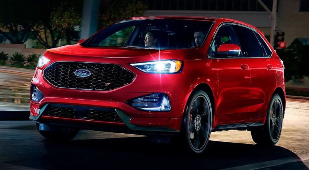 A red 2022 Ford Edge being driven on the road. | Ford dealer in Little Rock, AR.