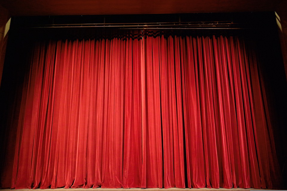 Red curtain on a stage. | Performance venues around Little Rock, AR.