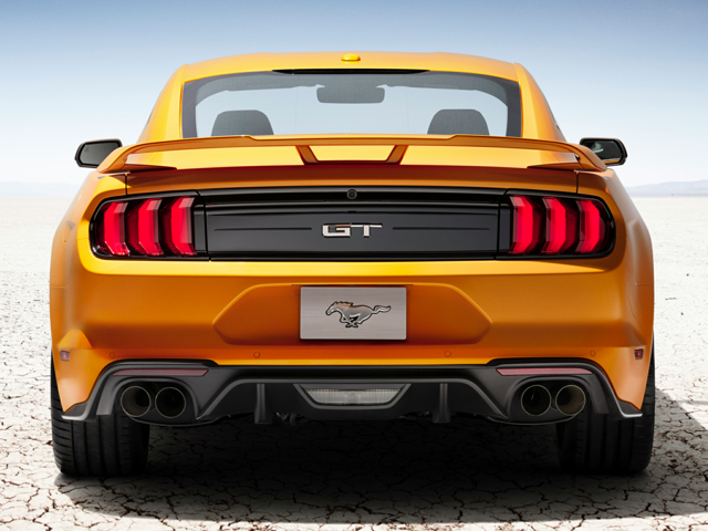 Rear view of an orange 2023 Ford Mustang GT. | Ford dealer in Little Rock, AR.