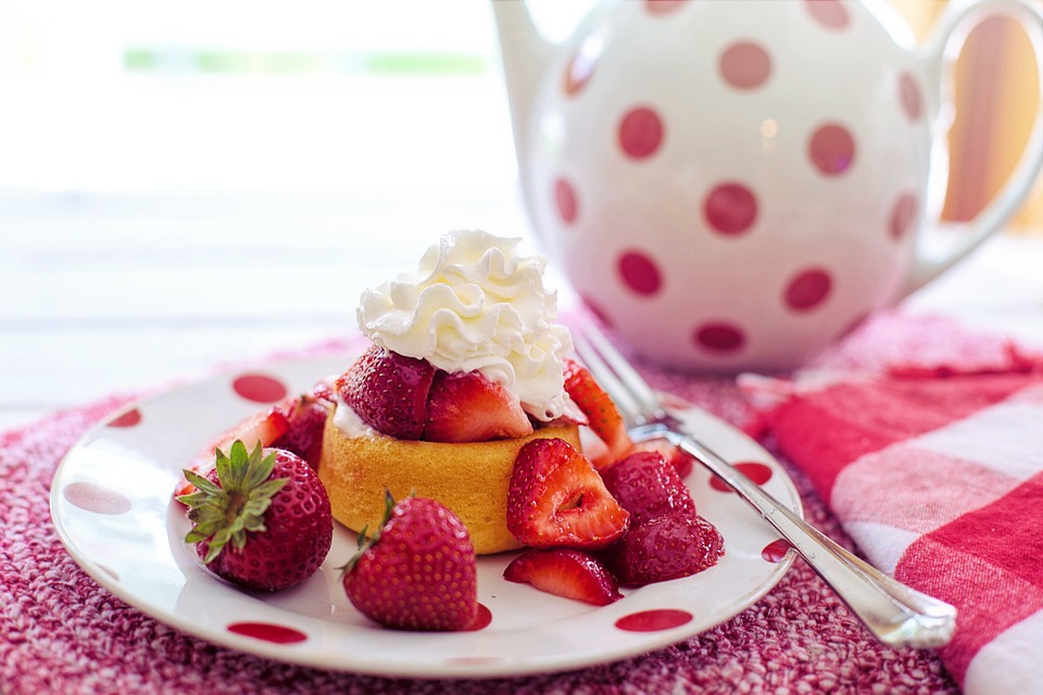 Strawberry shortcake dessert on a white and red polka dot saucer. | Things to do in the Spring | Crain Ford of Little Rock
