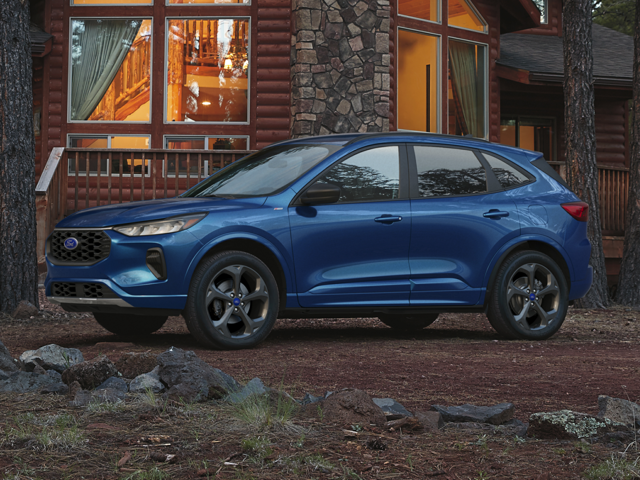 Profile view of a blue 2023 Ford Escape parked in front of a cabin. | Ford dealer in Little Rock, AR | Crain Ford of Little Rock
